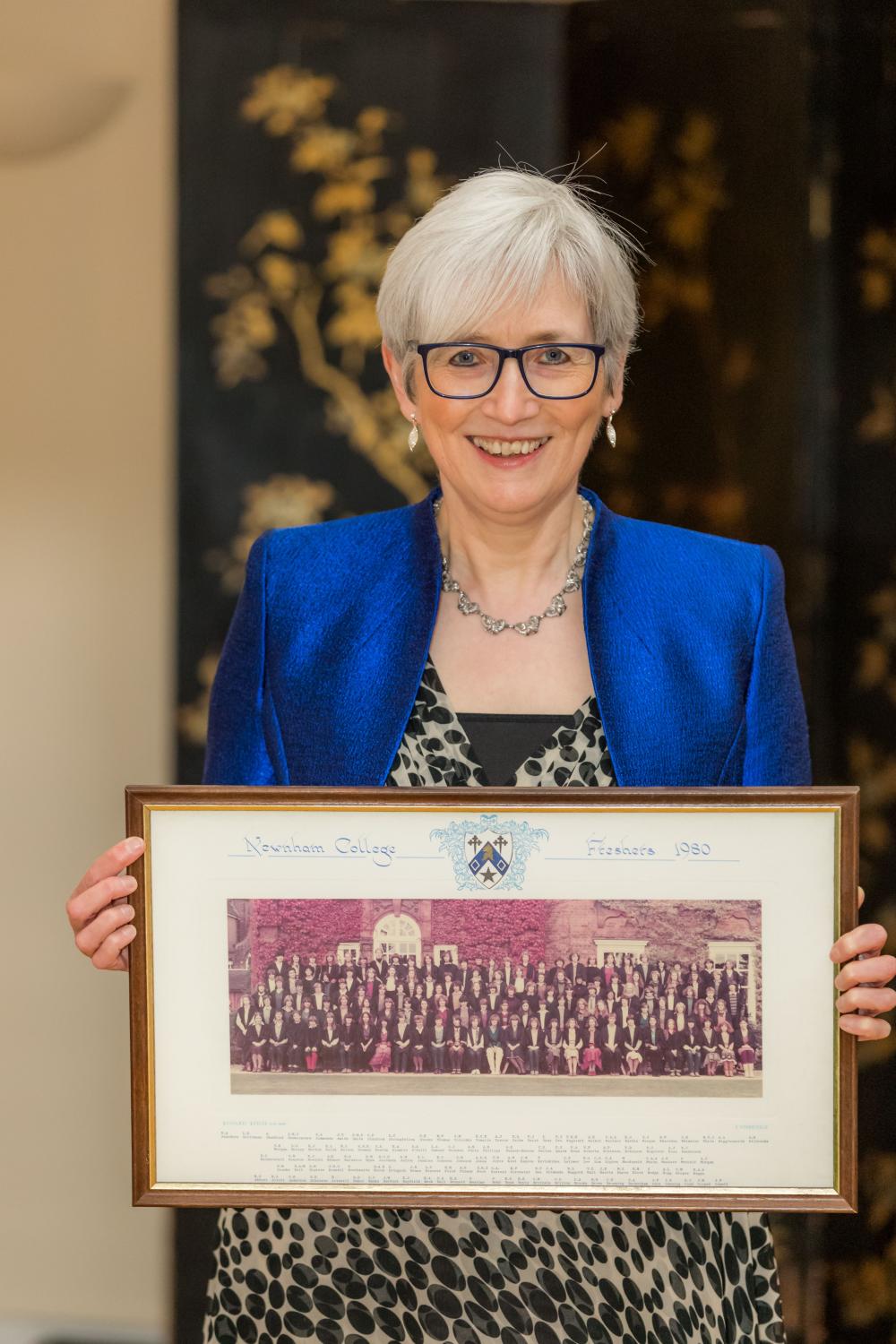 Alison Rose holding her matriculation photo