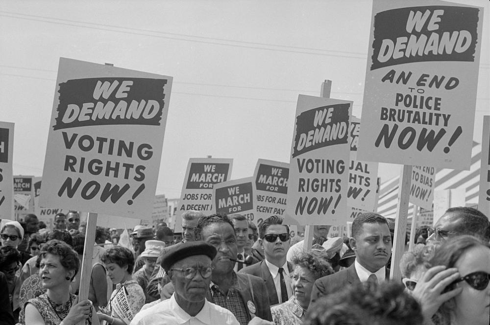 Marchers with signs at the March on Washington, 1963