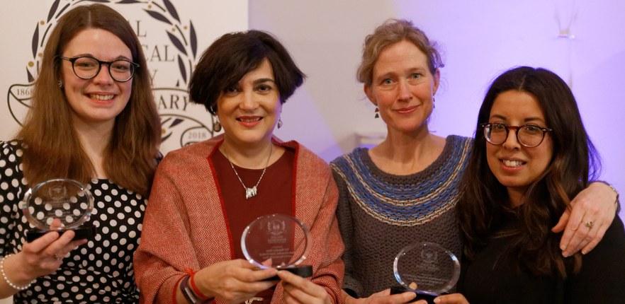 Image of four women holding awards