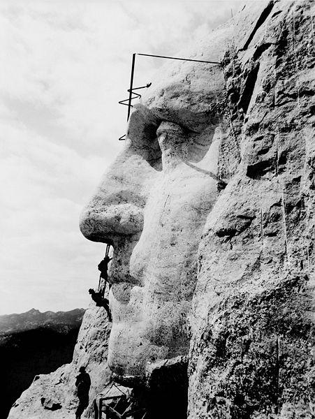 Construction at Mount Rushmore of George Washington's likeness.