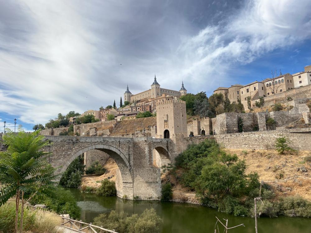 View of Toledo with a bridge over a river